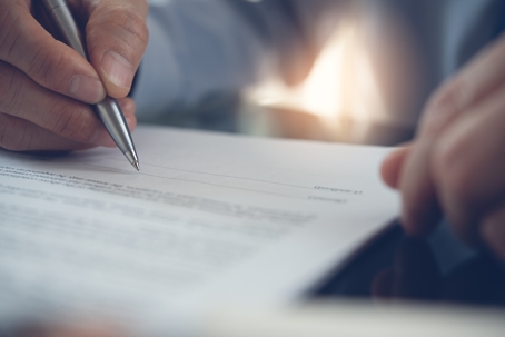Man signing a contract