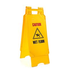 yellow a-frame "wet floor" sign